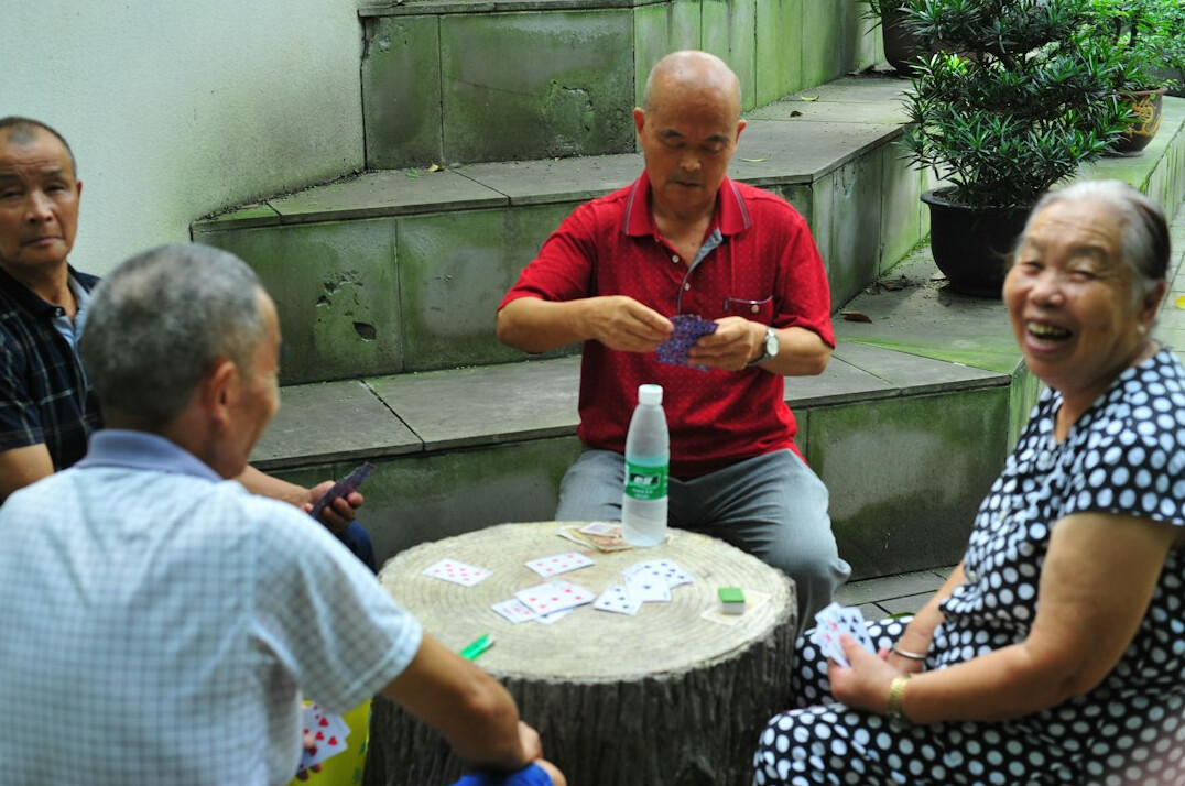 group of seniors playing cards