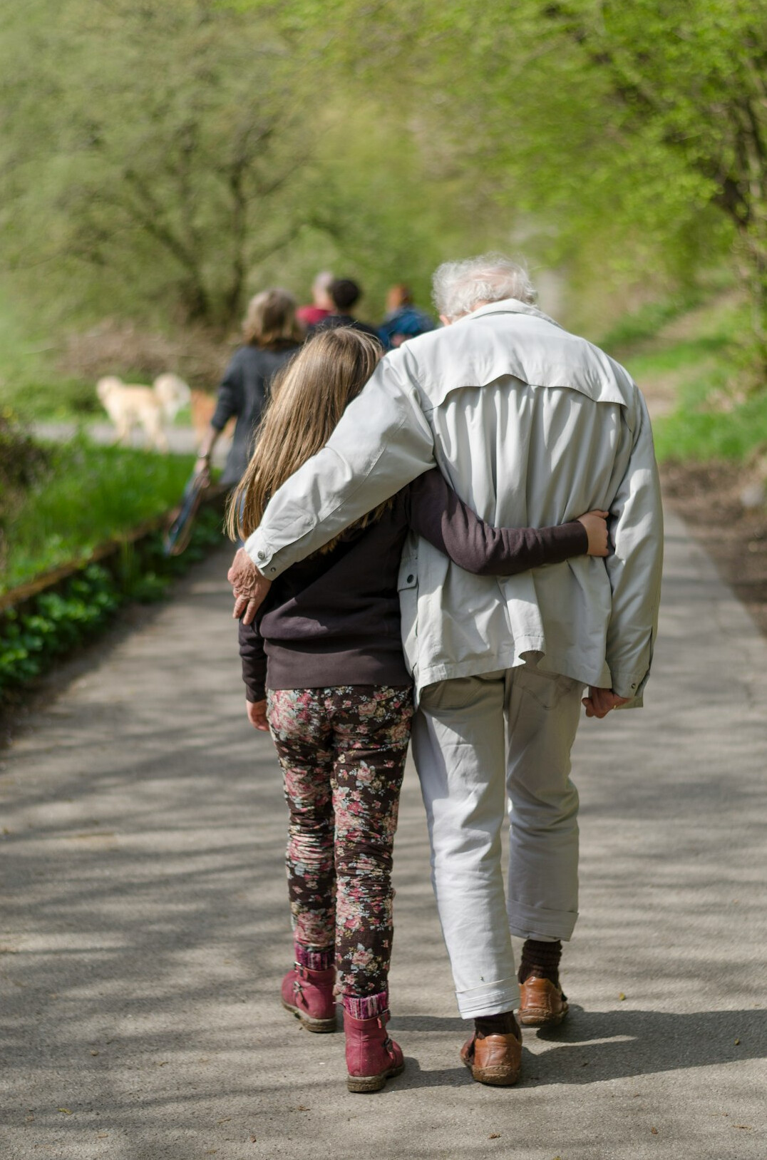 Adult daughter helping her elderly mother participate in community activities