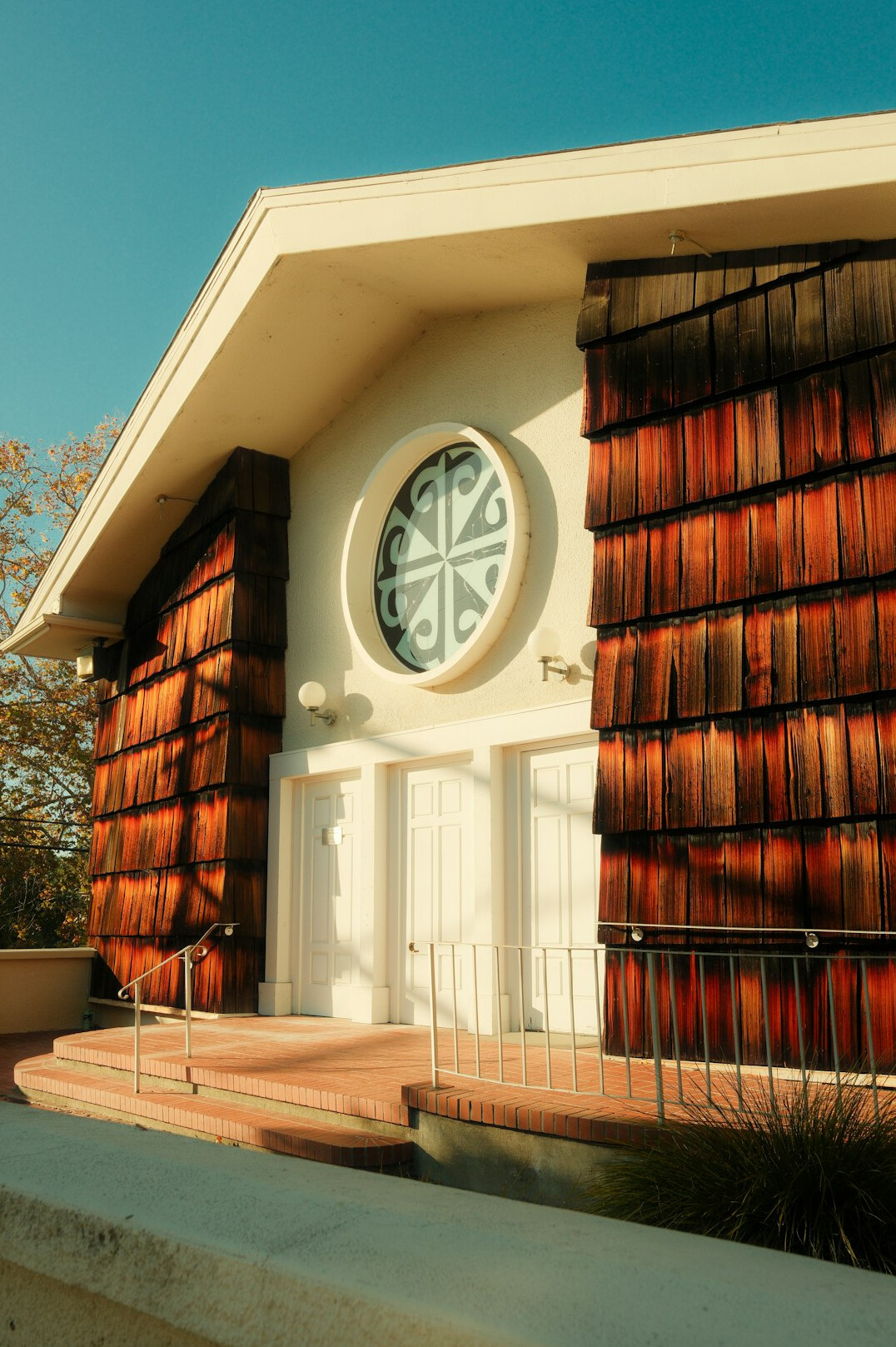 Cozy neighborhood community center building exterior with warm entrance
